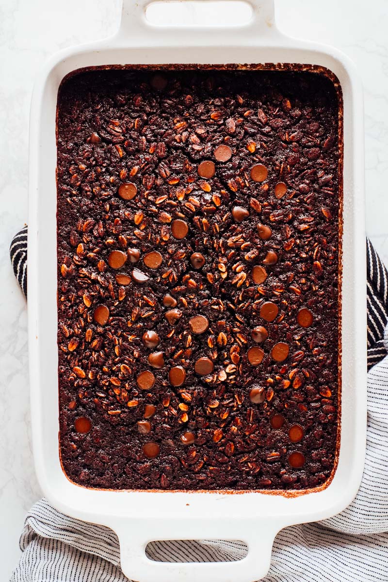 Baked oatmeal cooked in a ceramic baking dish.