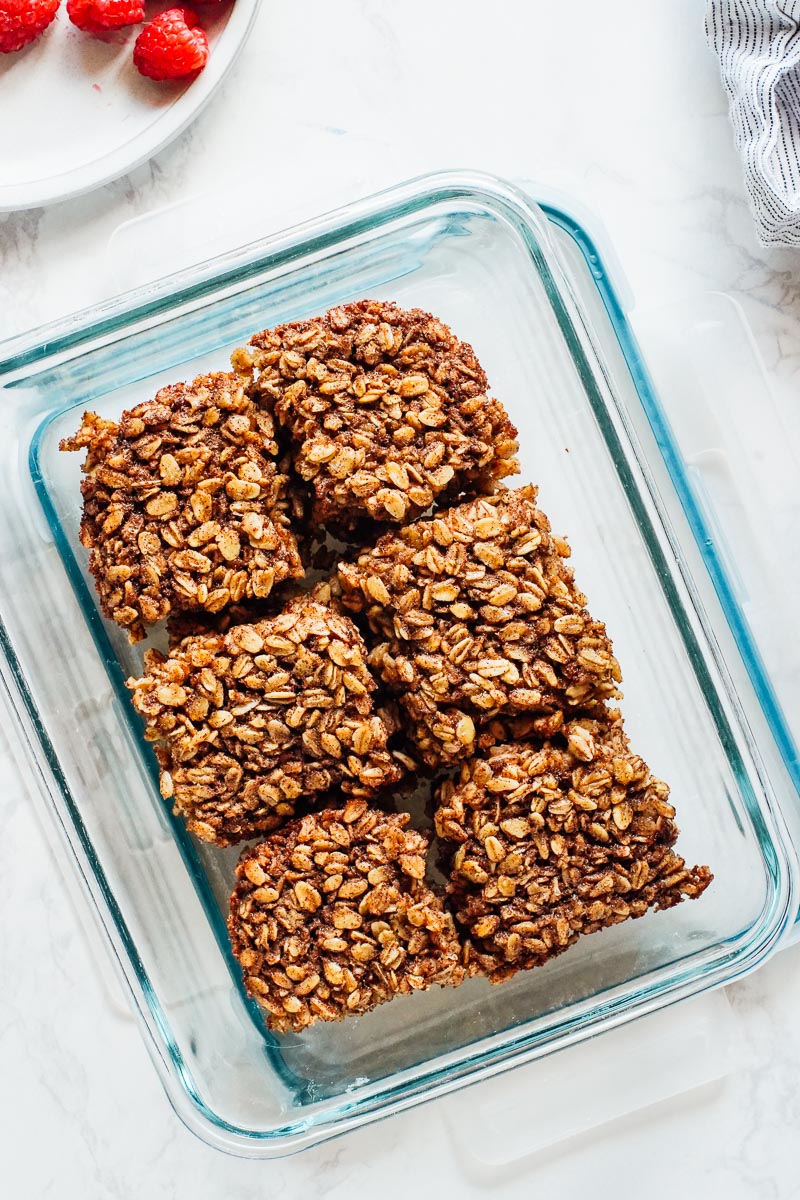 Baked oat bars in a storage jar.