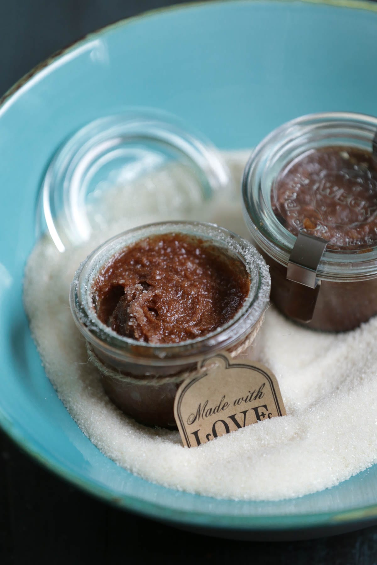 Homemade lip scrub in a bowl with sugar. 