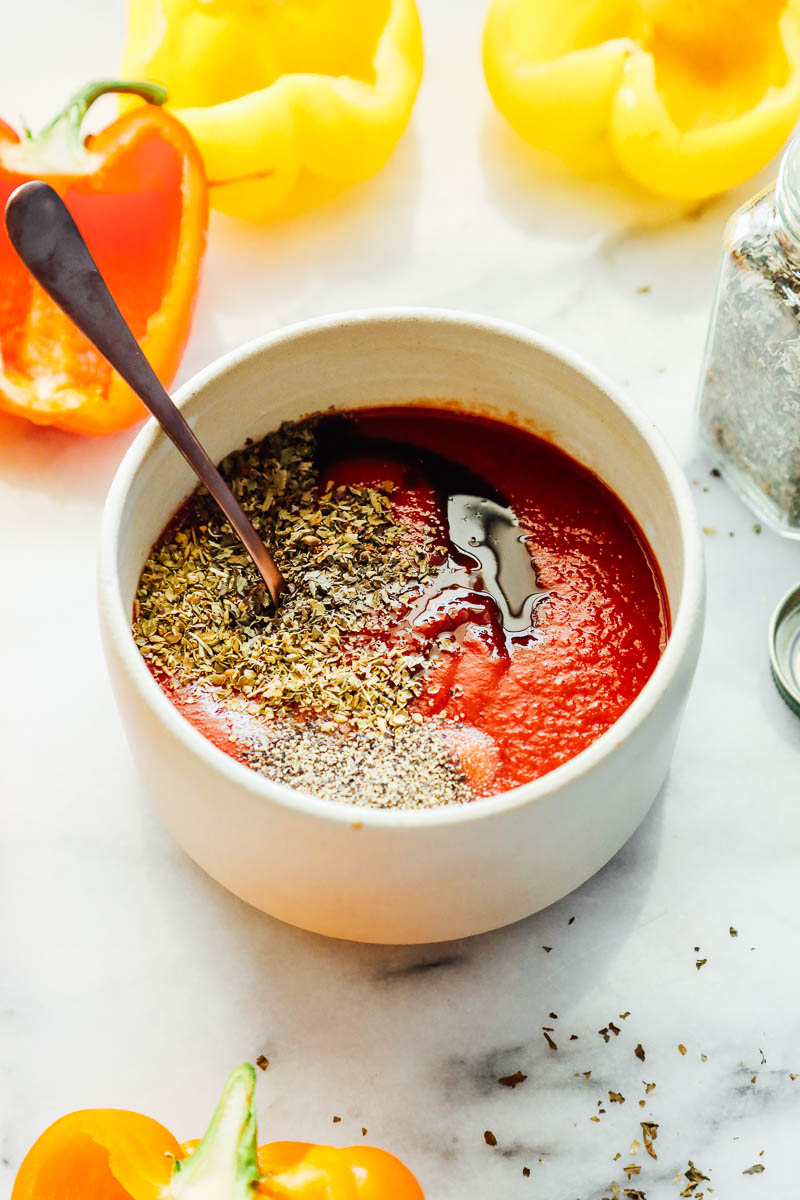 Tomato sauce and seasonings in a bowl.