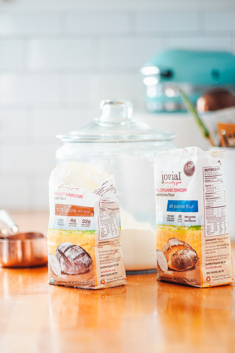 Two bags of einkorn flour on a countertop.