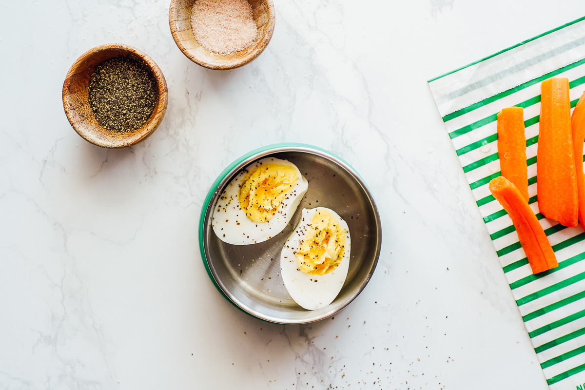 Hardboiled eggs and carrot sticks