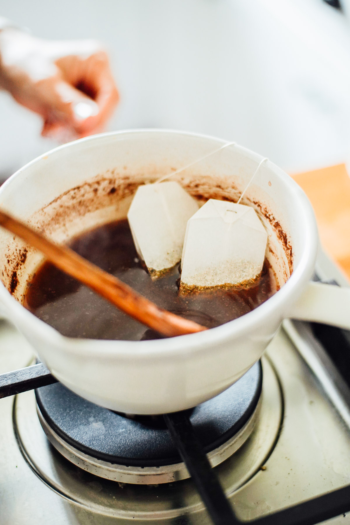 Tea bags in a pot with chai spices.