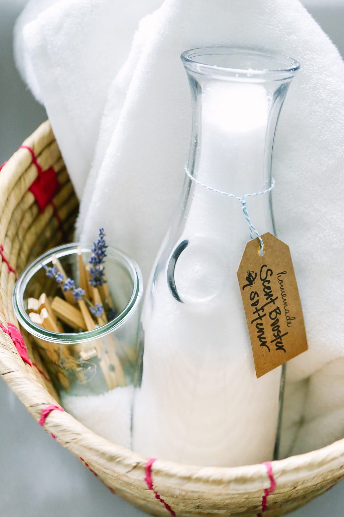 Laundry scent booster and laundry softener in a bowl.