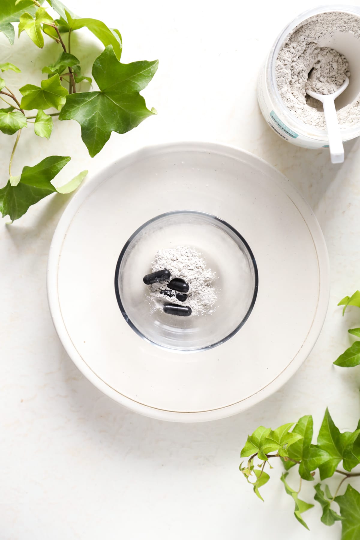 Clay and activated charcoal in a small bowl. 