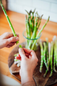 Breaking the ends off the asparagus stems..