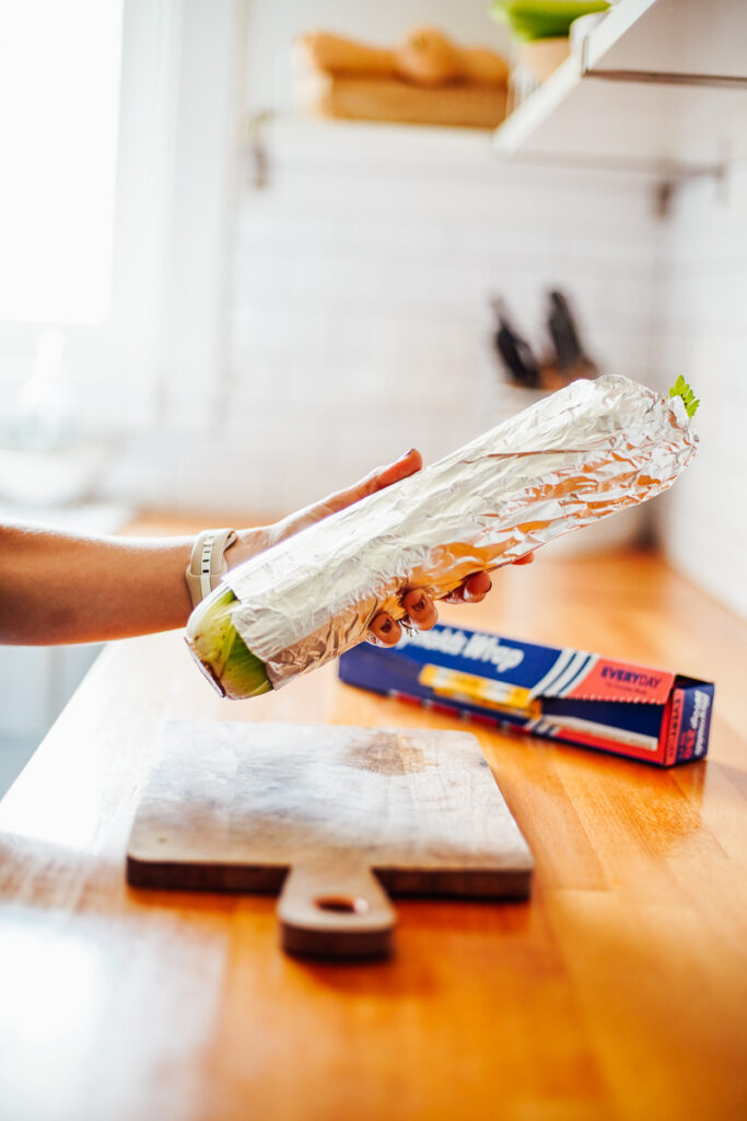 Celery rolled up in a piece of foil.