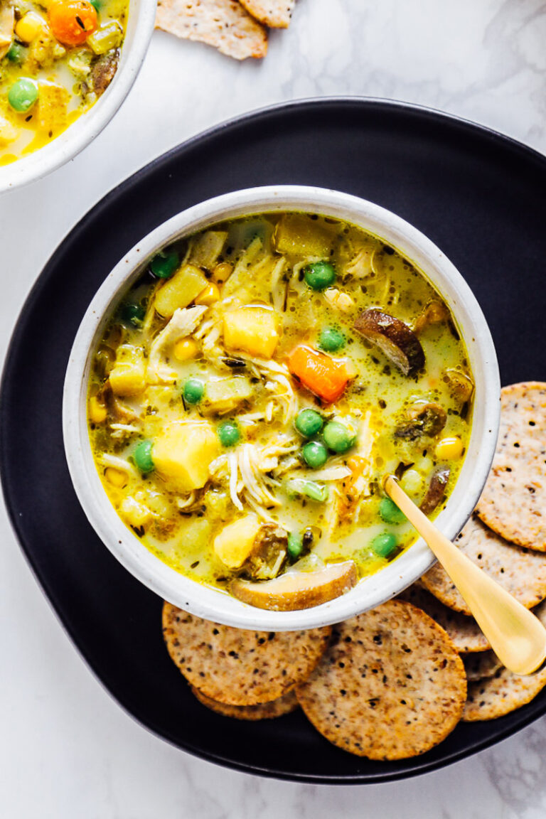 A bowl of Instant Pot Chicken Pot Pie Soup with crackers.