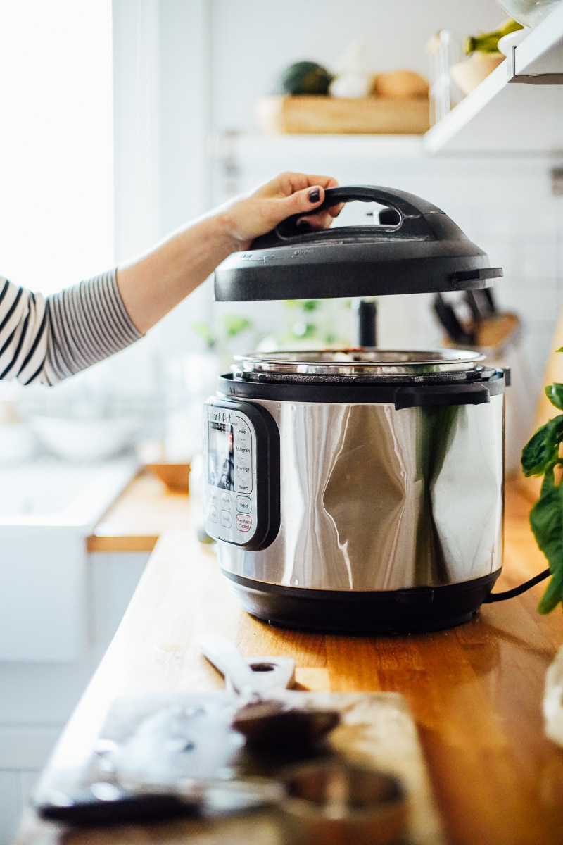 Placing the lid on the Instant Pot.