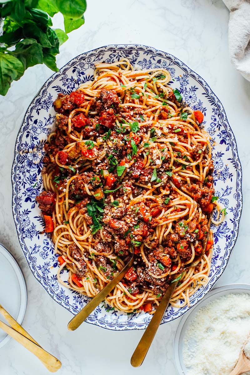 Plated pasta with bolognese sauce mixed together.