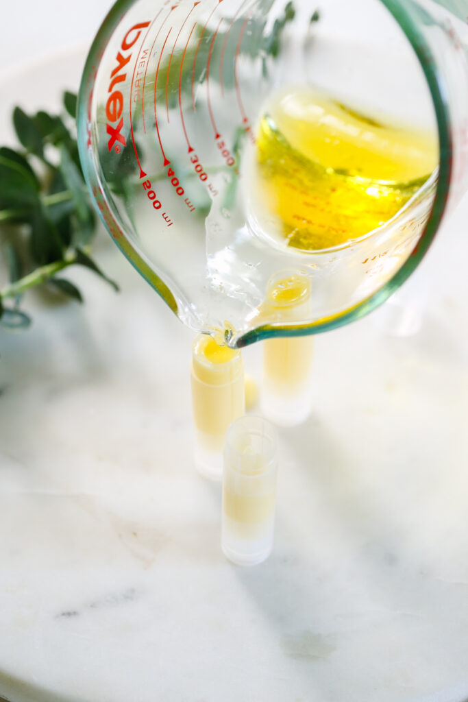 Pouring the melted ingredients in tubes or containers. 