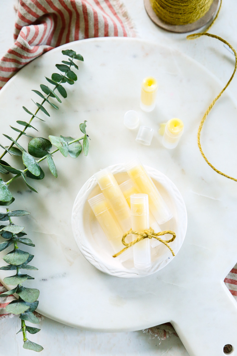 Tubes of homemade lip balm on a plate.