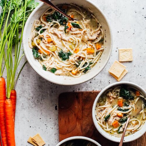 Chicken noodle soup in bowls.