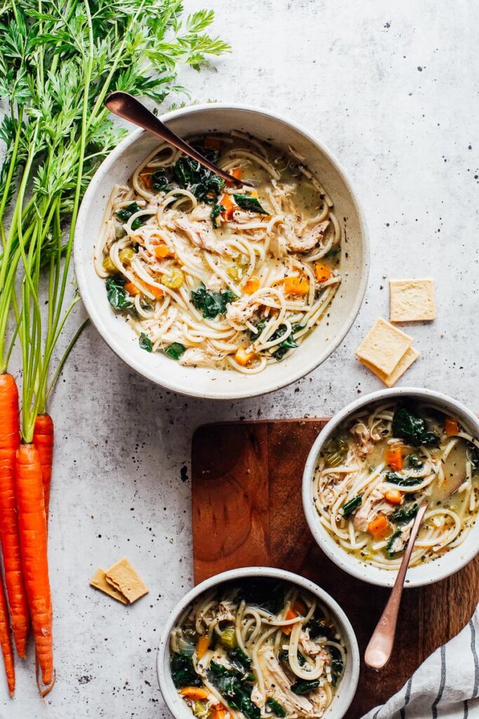 Chicken noodle soup in bowls.