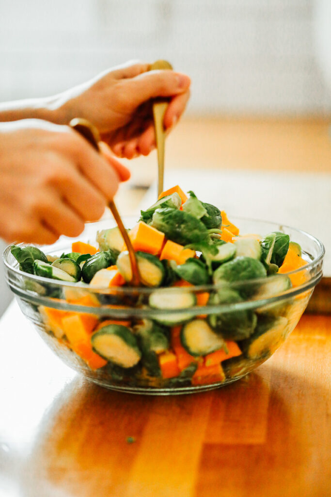 Toss the veggies in the olive oil and seasonings.