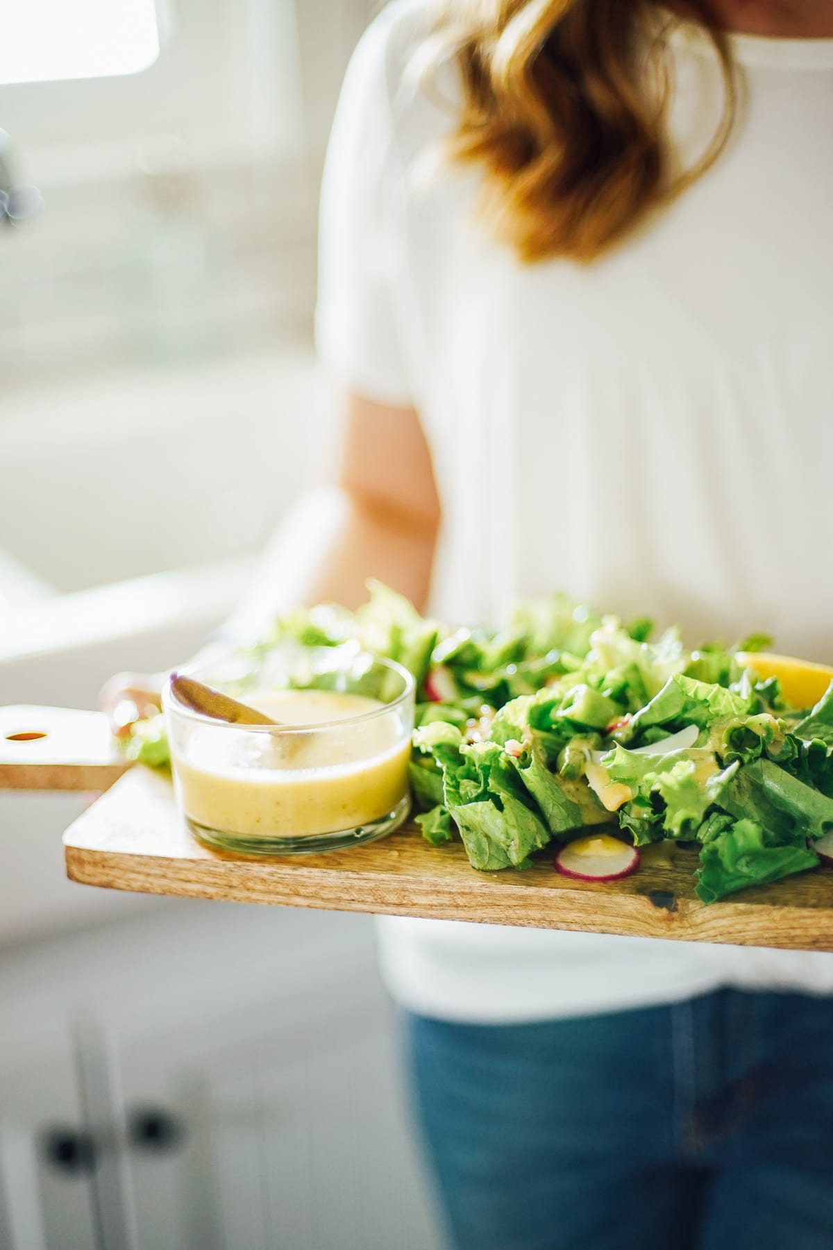 Serving a green salad with dressing on the side. 