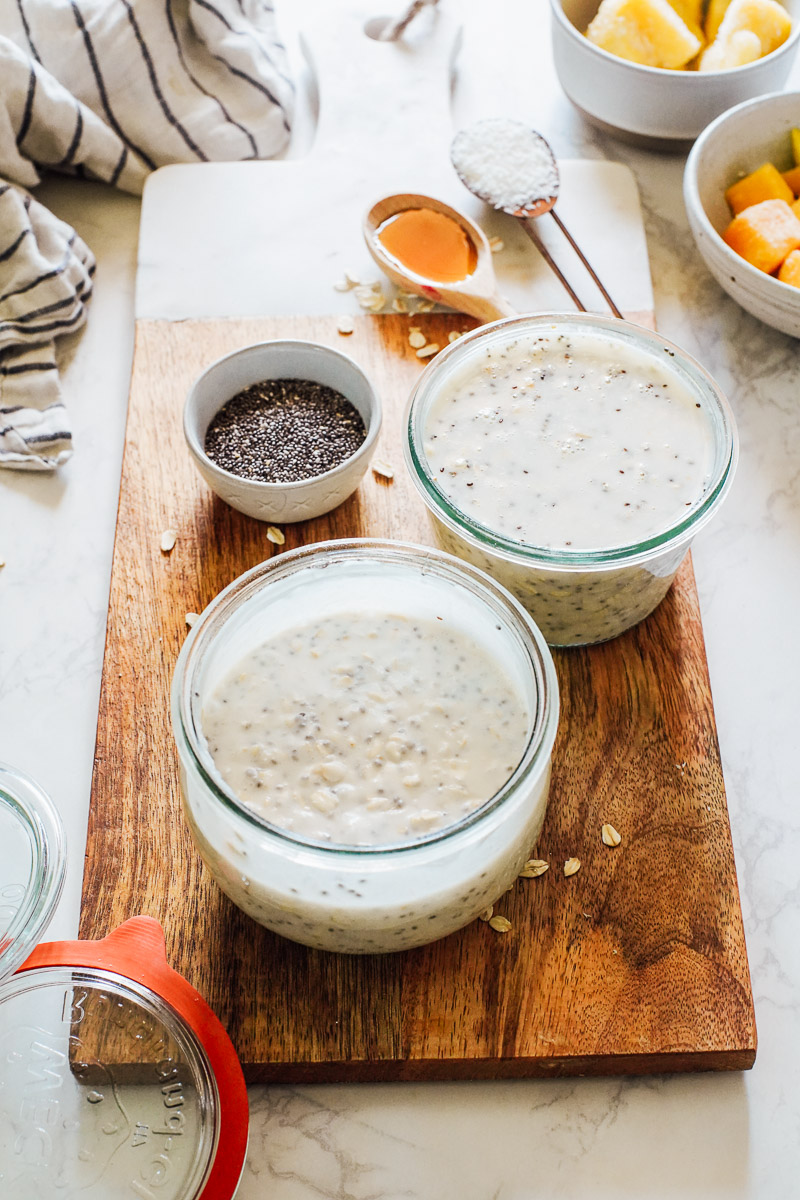 Dry and liquid ingredients combined in glass jars.